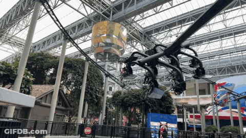 Roller Coaster In Building With Red Exit Sign GIF