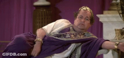Roman Emperor Lying On Throne Arms Crossed GIF