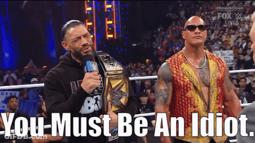 Roman Reigns And The Rock Are Standing Next To Each Other In A Wrestling Ring With The Words You Must Be An Idiot Below GIF