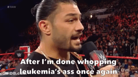 Roman Reigns Is Talking Into A Microphone During A Wrestling Match GIF
