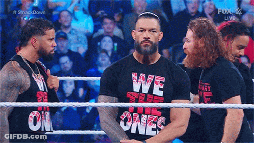 Roman Reigns Is Wearing A Black Shirt That Says We The Ones On It . GIF