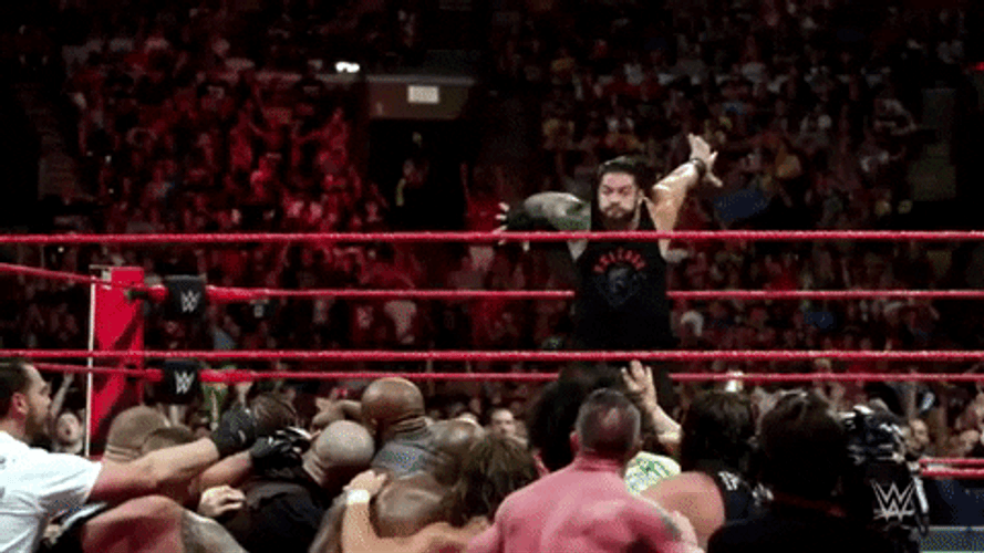 Roman Reigns Out The Ring Dive GIF