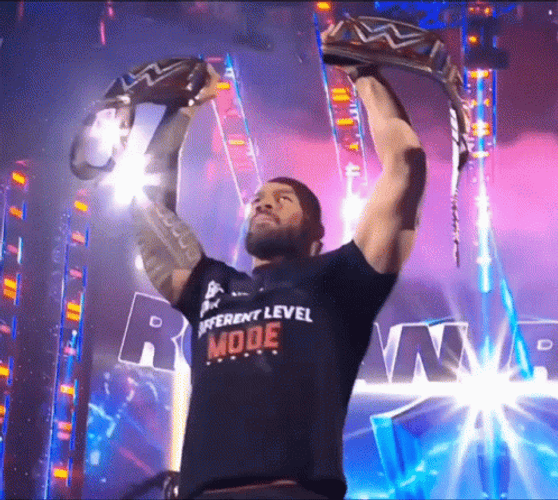 Roman Reigns Raises 2 Champions Belt GIF