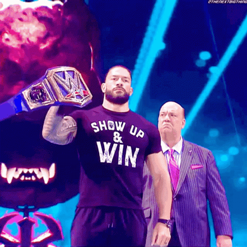 Roman Reigns Raises Belt GIF