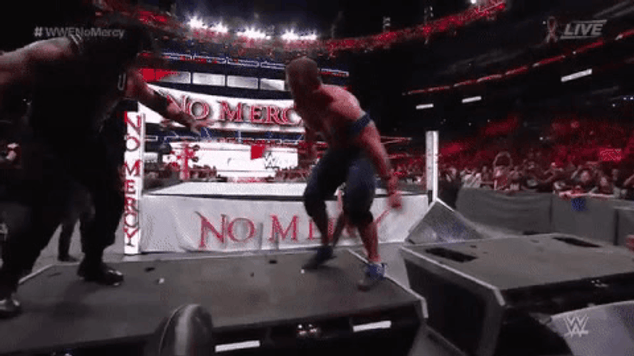 Roman Reigns Tackles John Cena GIF