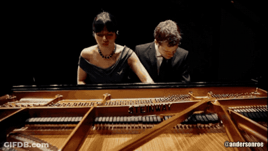 Romantic Couple Playing Piano GIF