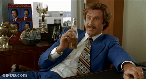 Ron Burgundy Is 11 In San Diego On A Sign Behind Him GIF