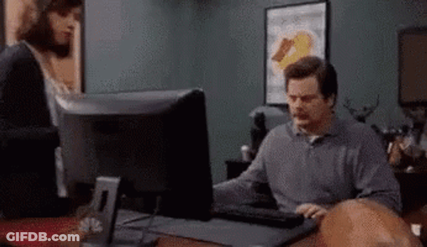 Ron Swanson Computer With Greatest Showman Poster GIF