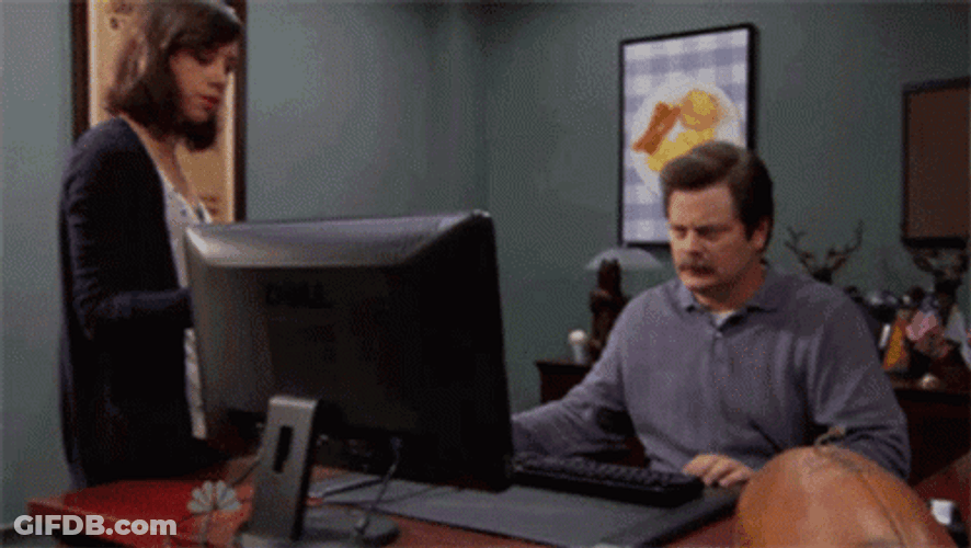 Ron Swanson Throwing Computer Into Garbage Container GIF