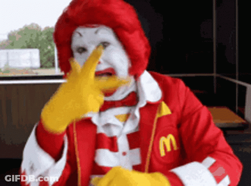 Ronald McDonald Holding Finger To Nose GIF