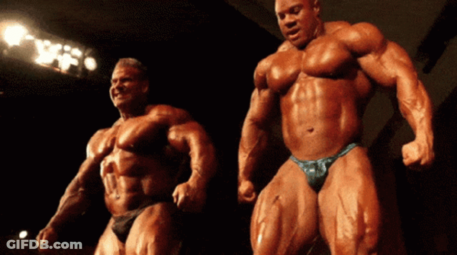 Ronnie Coleman With A Man Competing GIF