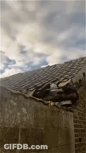 Roof With Hole And Cloudy Sky GIF