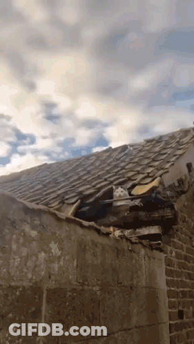 Roof With Hole And Cloudy Sky GIF