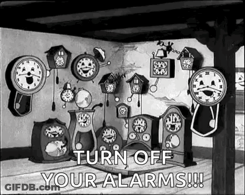 Room Filled With Clocks And Turn Off Alarms Sign GIF