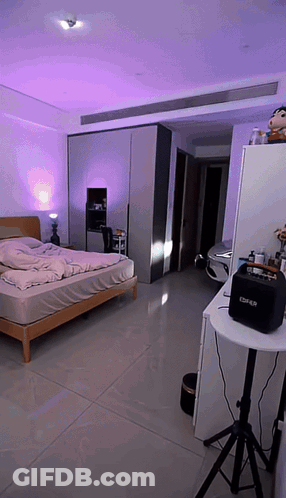 Room With Bed And Speaker Saying Cs4n GIF