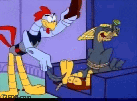 Rooster Standing Next To Chicken Tied Up In Box GIF