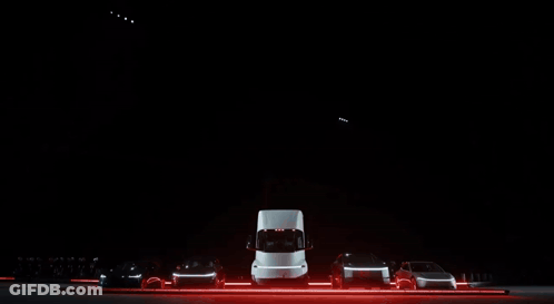 Row Of Cars Parked In Dark Lot GIF