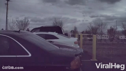 Row Of Cars Parked In Parking Lot Viralhog GIF