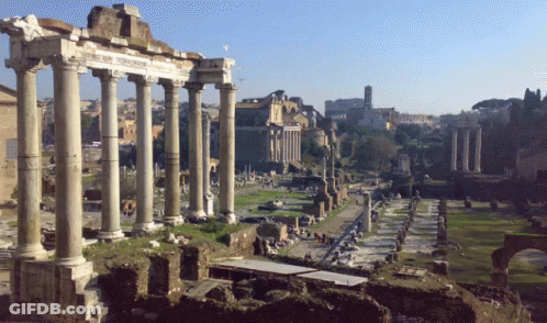 Row Of Columns In Ruined Area With Building GIF