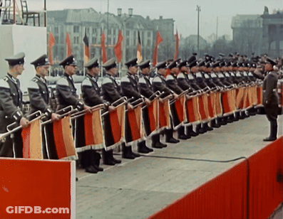 Row Of Men In Military Uniforms Standing In Line GIF