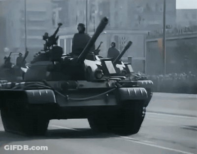 Row Of Military Tanks In Black And White GIF
