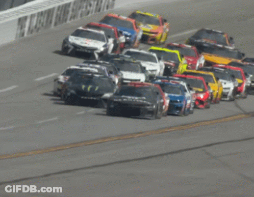 Row Of Race Cars On Track GIF