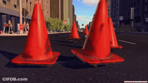 Row Of Red Traffic Cones On Street GIF