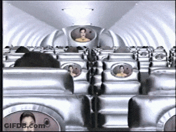 Row Of Silver Airplane Seats With Man In Back GIF