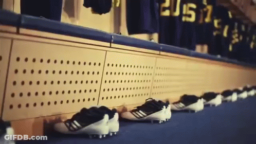 Row Of Soccer Cleats Lined Up With 2015 Jerseys GIF