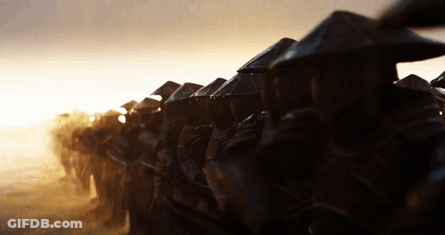 Row Of Soldiers In Conical Hats Walking GIF