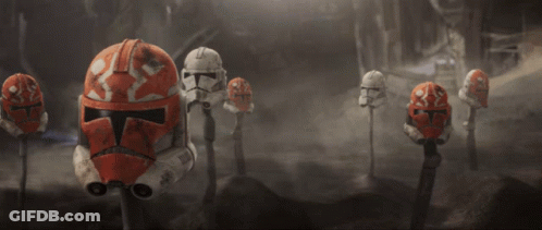Row Of Storm Trooper Helmets On Sticks GIF