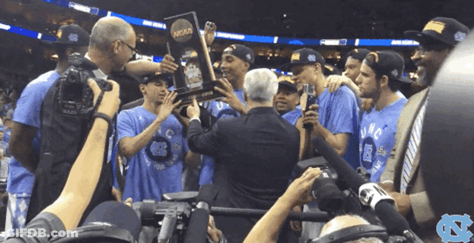 Roy Williams Proudly Raising Their Trophy GIF