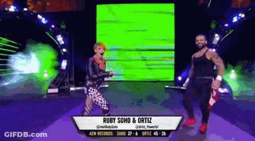 Ruby Soho And Ortiz Are Dancing On A Stage GIF