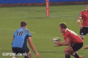 Rugby Player Number 23 Being Tackled GIF