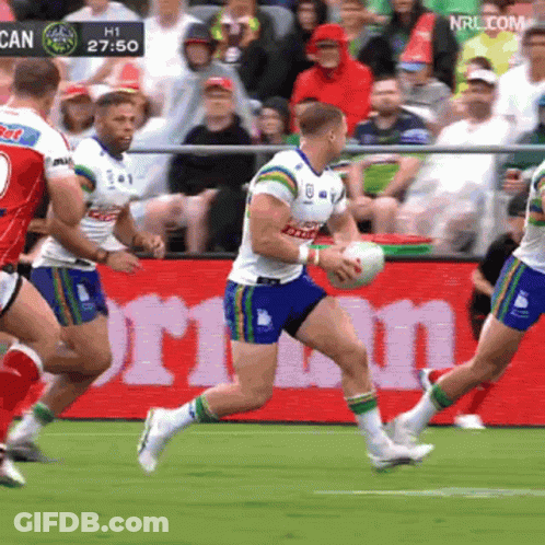 Rugby Players Running In Front Of NRLcom Sign GIF