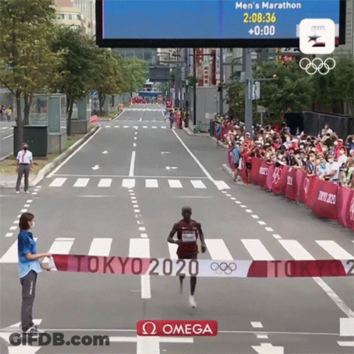 Runner Crosses Finish Line At Tokyo 2020 Marathon GIF