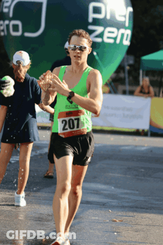 Runner In Green Shirt Number 207 GIF