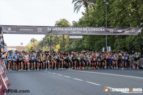 Runners Lined Up In Front Of 36 Media Maraton De Cordoba Banner GIF