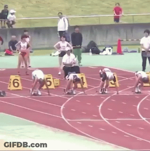 Runners Ready On Track With Numbered Blocks GIF