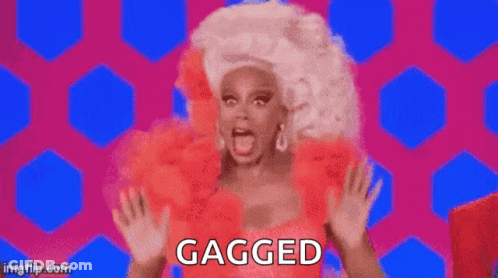 Rupaul In Red Dress And White Wig Saying Gagged GIF