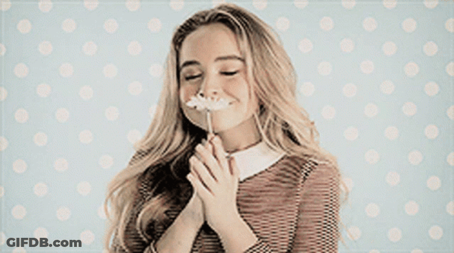 Sabrina Carpenter Holding A Flower GIF