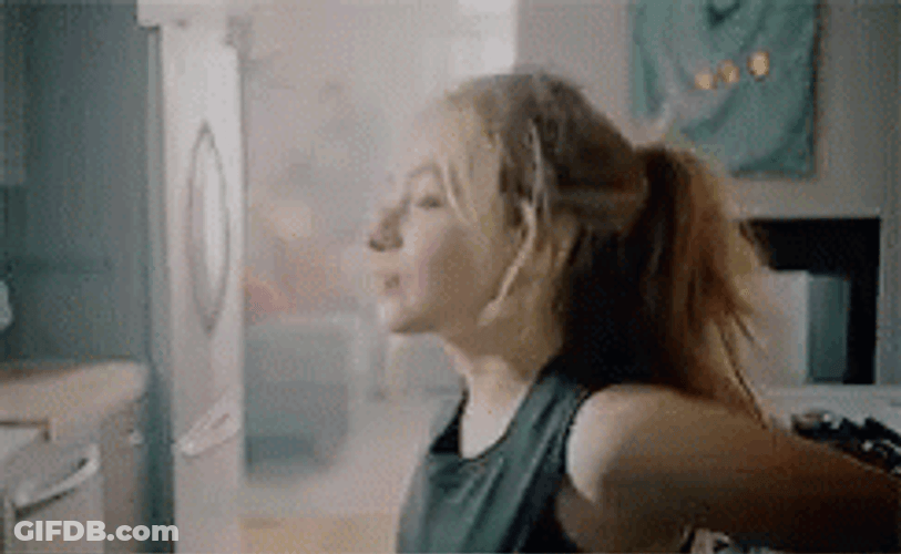 Sabrina Carpenter Sitting On Countertop GIF