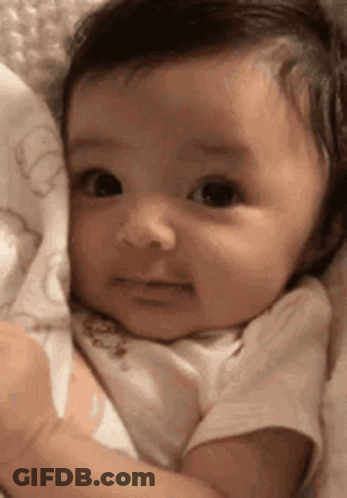 Sad Baby Lying On Blanket GIF