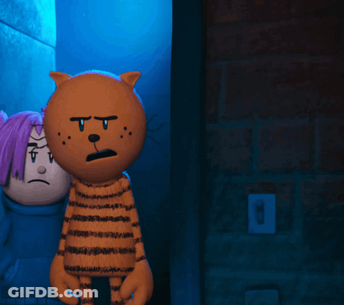 Sad Cartoon Character Beside Stuffed Animal GIF