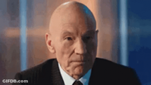 Sad Cartoon Character In Front Of Alien Crowd GIF