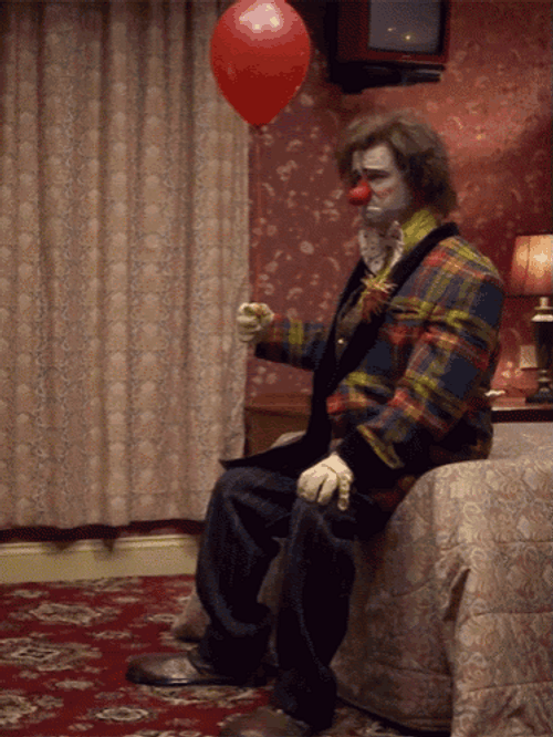 Sad Clown With Balloon GIF