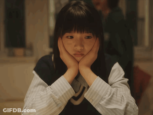 Sad Girl With Hands On Face GIF