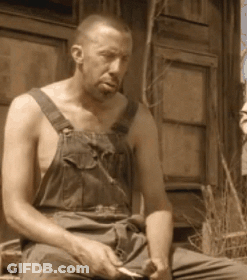 Sad Hillbilly Sharpening A Knife GIF