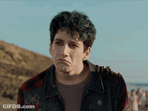 Sad Man In Plaid Shirt And Denim Jacket GIF