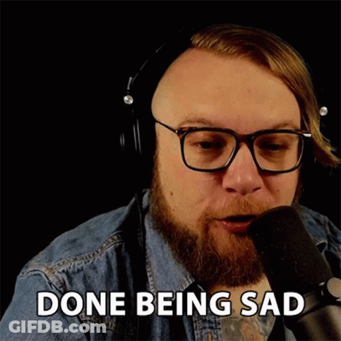 Sad Man With Headphones Talking Into Microphone GIF